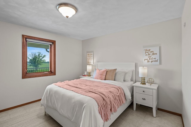 19800 Stephan Dr, Minnewaska Twp, MN 56381 - bedroom with baseboards and light tile patterned floors