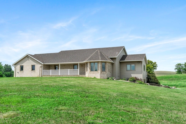 19800 Stephan Dr, Minnewaska Twp, MN 56381 - view of front facade featuring brick siding, a front yard, and a porch