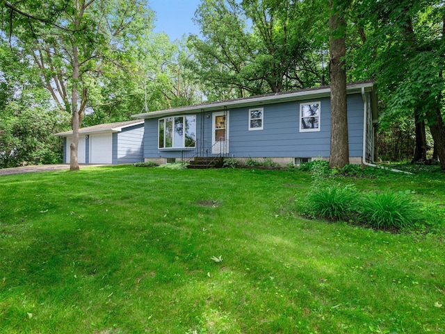 8545 70th St NW, Annandale, MN 55302 - ranch-style house with a front yard, a garage, and asphalt driveway