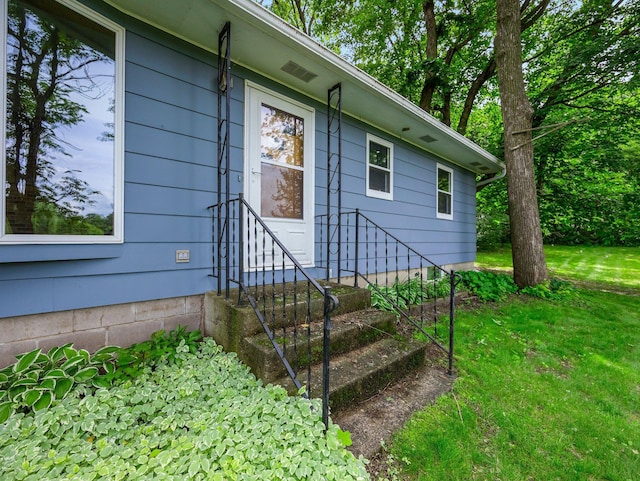8545 70th St NW, Annandale, MN 55302 - doorway to property featuring a yard