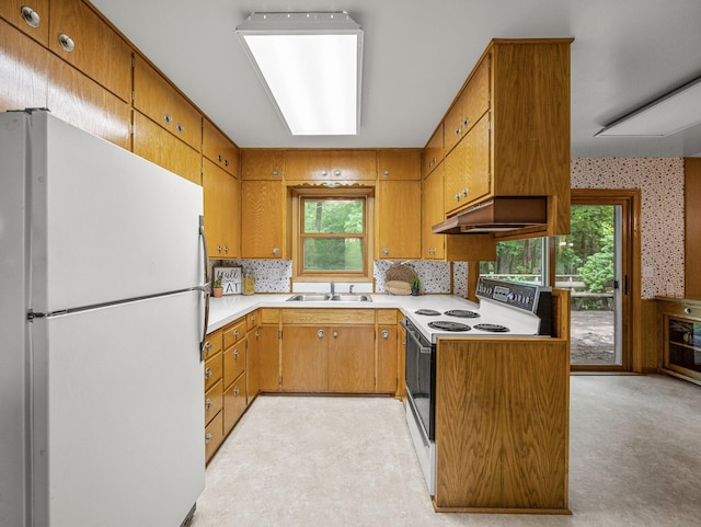 8545 70th St NW, Annandale, MN 55302 - kitchen featuring white appliances, ventilation hood, and brown cabinetry