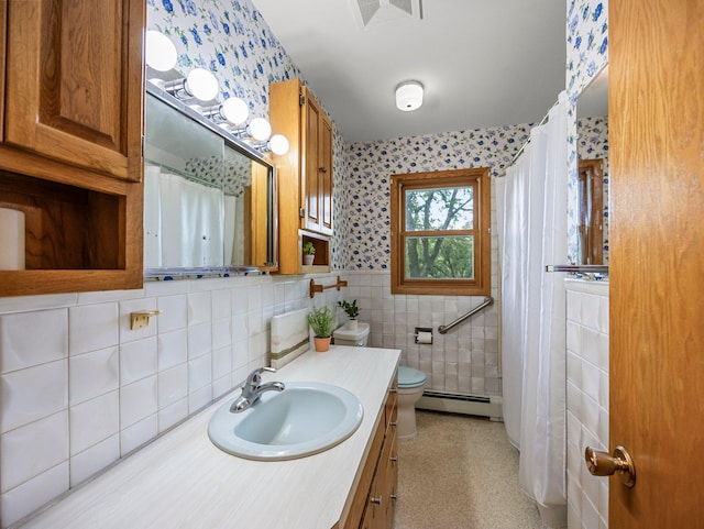 8545 70th St NW, Annandale, MN 55302 - full bathroom featuring wallpapered walls, a baseboard radiator, vanity, tile walls, and a shower with curtain