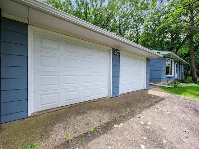 8545 70th St NW, Annandale, MN 55302 - garage featuring concrete driveway
