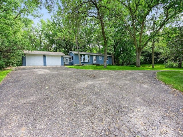 8545 70th St NW, Annandale, MN 55302 - view of front of property with a front lawn, a detached garage, and view of scattered trees