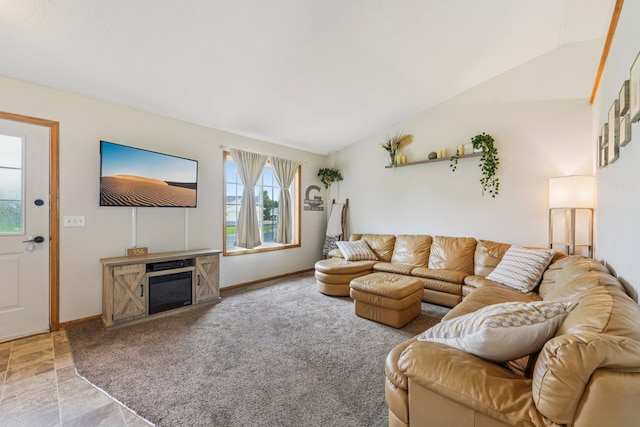 608 Frontier Cir, Belle Plaine, MN 56011 - carpeted living area featuring plenty of natural light, vaulted ceiling, and a glass covered fireplace