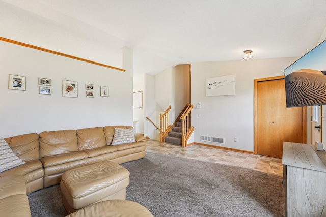 608 Frontier Cir, Belle Plaine, MN 56011 - carpeted living area with stairs and vaulted ceiling