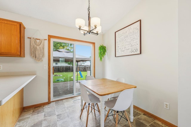 608 Frontier Cir, Belle Plaine, MN 56011 - dining space featuring a chandelier and stone finish flooring