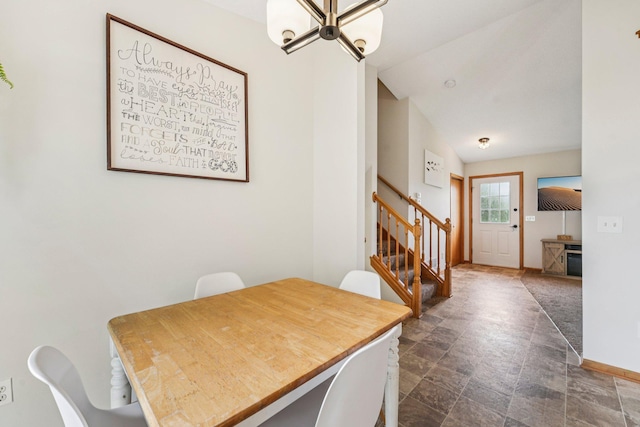 608 Frontier Cir, Belle Plaine, MN 56011 - dining area featuring stairway, a chandelier, and stone finish floors