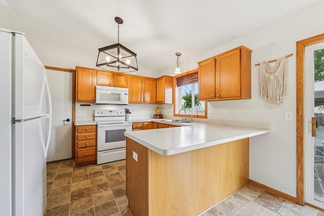 608 Frontier Cir, Belle Plaine, MN 56011 - kitchen with white appliances, a peninsula, healthy amount of natural light, light countertops, and vaulted ceiling