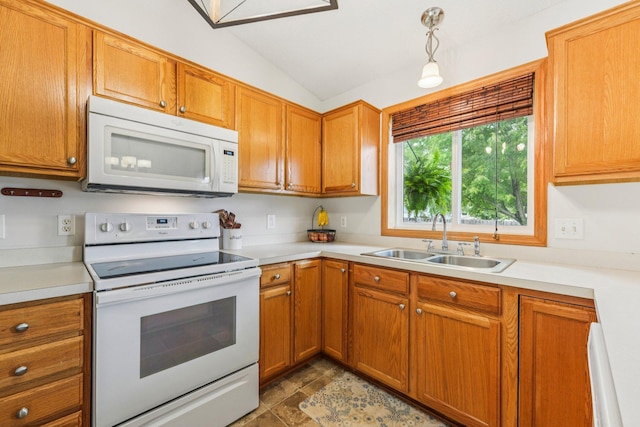 608 Frontier Cir, Belle Plaine, MN 56011 - kitchen with white appliances, vaulted ceiling, light countertops, and brown cabinetry