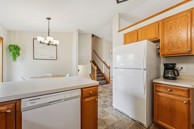 608 Frontier Cir, Belle Plaine, MN 56011 - kitchen with white appliances, a chandelier, light countertops, brown cabinetry, and hanging light fixtures