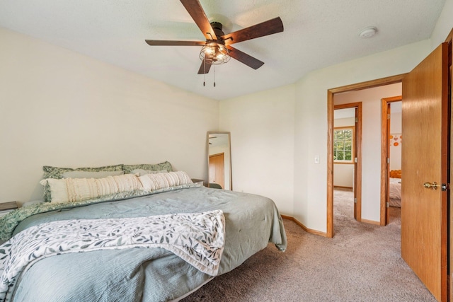 608 Frontier Cir, Belle Plaine, MN 56011 - carpeted bedroom with baseboards and a ceiling fan