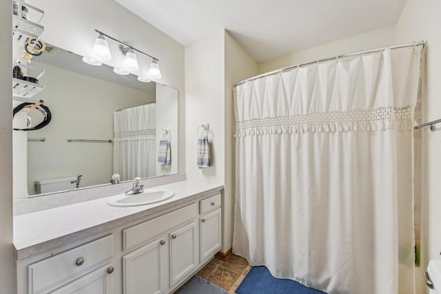 608 Frontier Cir, Belle Plaine, MN 56011 - bathroom with vanity, tile patterned flooring, and a shower with shower curtain