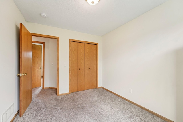 608 Frontier Cir, Belle Plaine, MN 56011 - unfurnished bedroom featuring light colored carpet and a closet