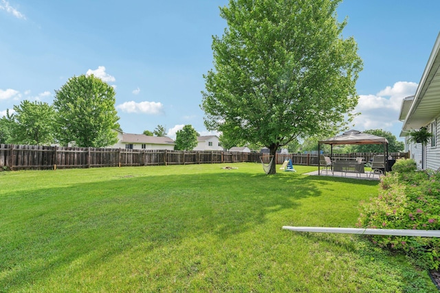 608 Frontier Cir, Belle Plaine, MN 56011 - fenced backyard with a gazebo and a patio