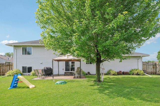 608 Frontier Cir, Belle Plaine, MN 56011 - back of house with a gazebo and a patio area