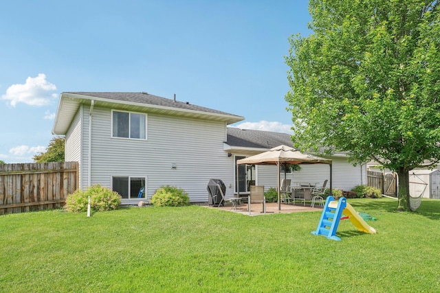 608 Frontier Cir, Belle Plaine, MN 56011 - rear view of house with a patio area and a fenced backyard