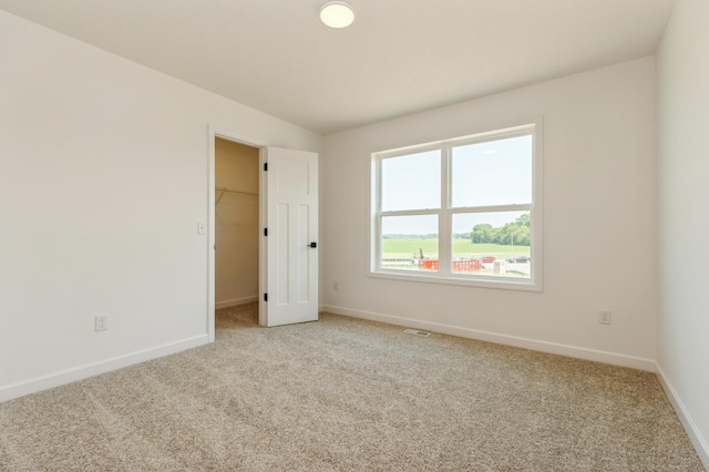 18665 Kennedy St NW, Elk River, MN 55330 - spare room with light carpet and baseboards