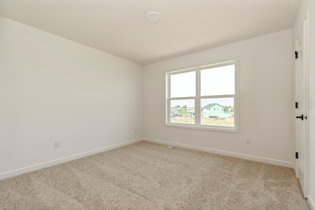 18665 Kennedy St NW, Elk River, MN 55330 - carpeted spare room featuring baseboards