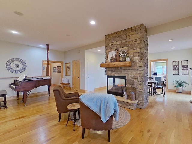 6828 Rhoades Ave SW, Cokato, MN 55321 - living area with light wood-style flooring, a fireplace, and recessed lighting