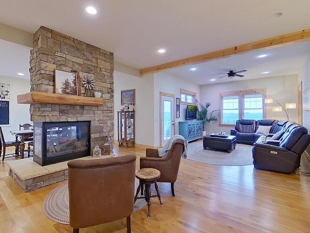 6828 Rhoades Ave SW, Cokato, MN 55321 - living room featuring wood finished floors, beamed ceiling, a fireplace, ceiling fan, and recessed lighting
