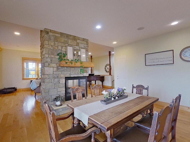 6828 Rhoades Ave SW, Cokato, MN 55321 - dining space with light wood finished floors, a fireplace, and recessed lighting