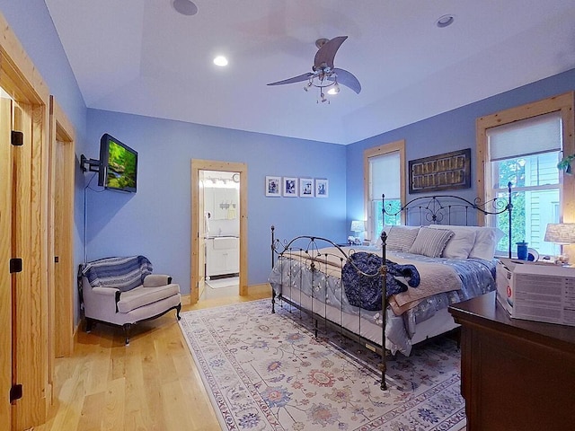 6828 Rhoades Ave SW, Cokato, MN 55321 - bedroom featuring vaulted ceiling, light wood finished floors, recessed lighting, ensuite bath, and ceiling fan