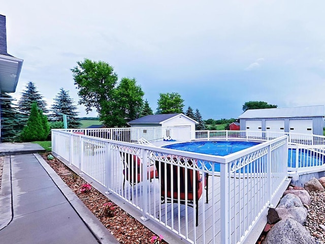 6828 Rhoades Ave SW, Cokato, MN 55321 - view of swimming pool with an outdoor structure