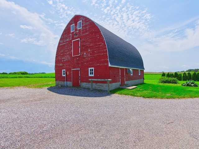 6828 Rhoades Ave SW, Cokato, MN 55321 - view of barn featuring a yard