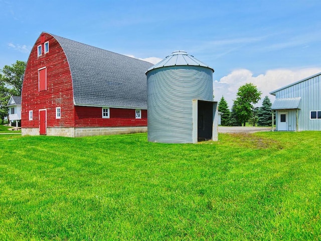 6828 Rhoades Ave SW, Cokato, MN 55321 - view of barn with a lawn
