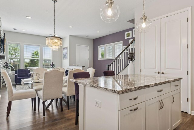8094 Arrowwood Ln N, Maple Grove, MN 55369 - kitchen with dark wood-style flooring, plenty of natural light, white cabinetry, hanging light fixtures, and recessed lighting
