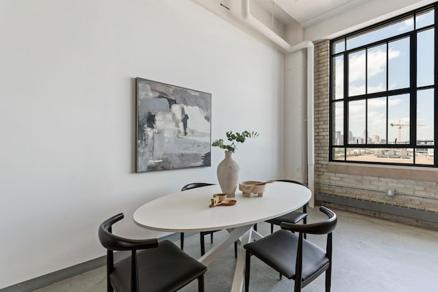 2929 Chicago Ave Unit 1208, Minneapolis, MN 55407 - dining room with healthy amount of natural light and finished concrete floors