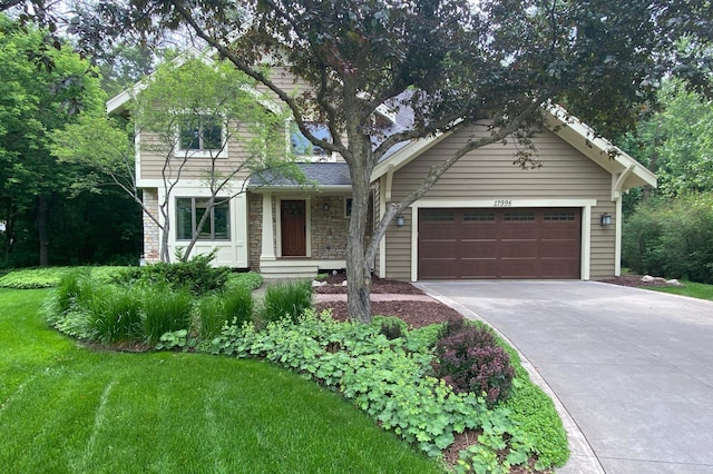 17995 Grove Ct, Eden Prairie, MN 55346 - view of front of house with asphalt driveway, a garage, stone siding, and a front lawn