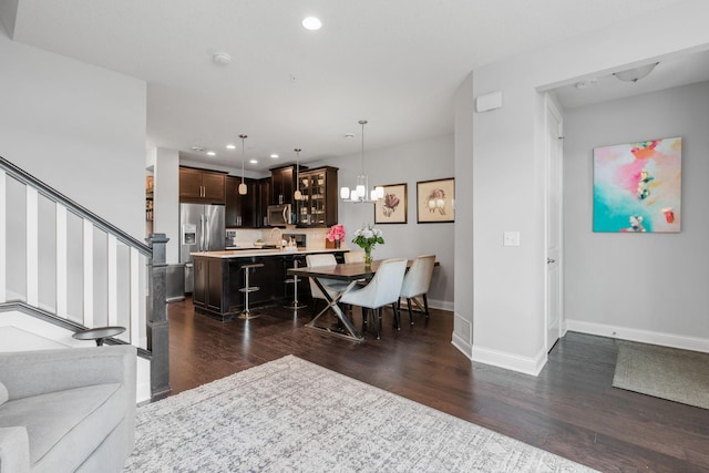 8312 Jonquil Ln N, Maple Grove, MN 55369 - living room featuring recessed lighting, dark wood-style floors, a chandelier, and stairway
