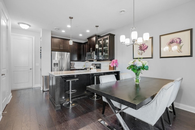 8312 Jonquil Ln N, Maple Grove, MN 55369 - dining space with a chandelier, dark wood-style floors, and recessed lighting
