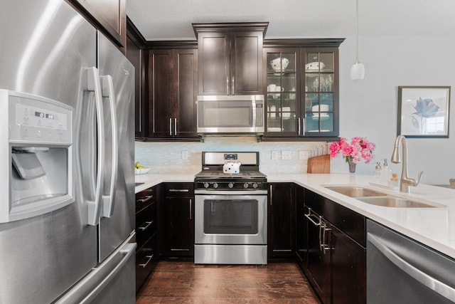 8312 Jonquil Ln N, Maple Grove, MN 55369 - kitchen with appliances with stainless steel finishes, dark wood-style floors, light countertops, and dark brown cabinets