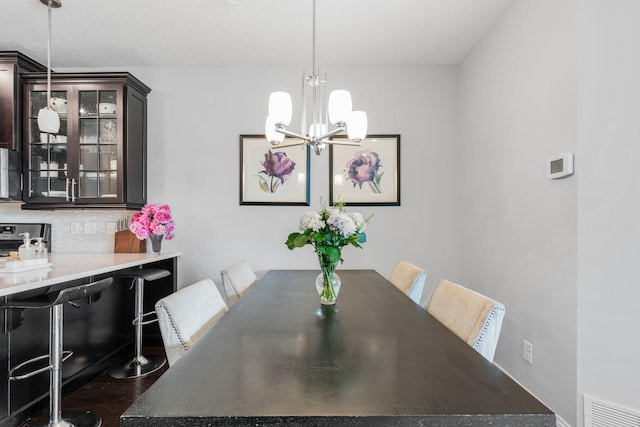 8312 Jonquil Ln N, Maple Grove, MN 55369 - dining space featuring a chandelier