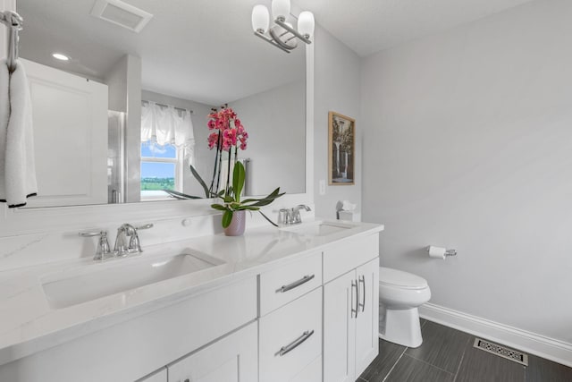 8312 Jonquil Ln N, Maple Grove, MN 55369 - bathroom with toilet and double vanity