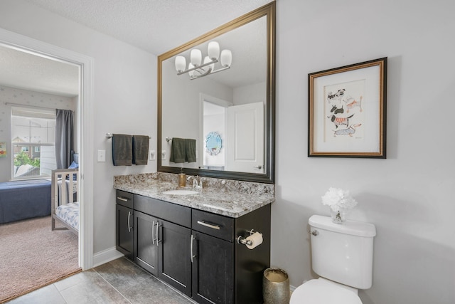 8312 Jonquil Ln N, Maple Grove, MN 55369 - ensuite bathroom featuring vanity, a chandelier, and a textured ceiling
