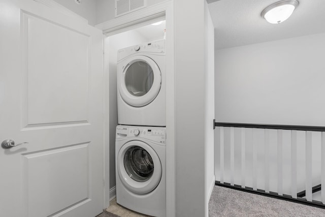 8312 Jonquil Ln N, Maple Grove, MN 55369 - washroom with stacked washer / dryer