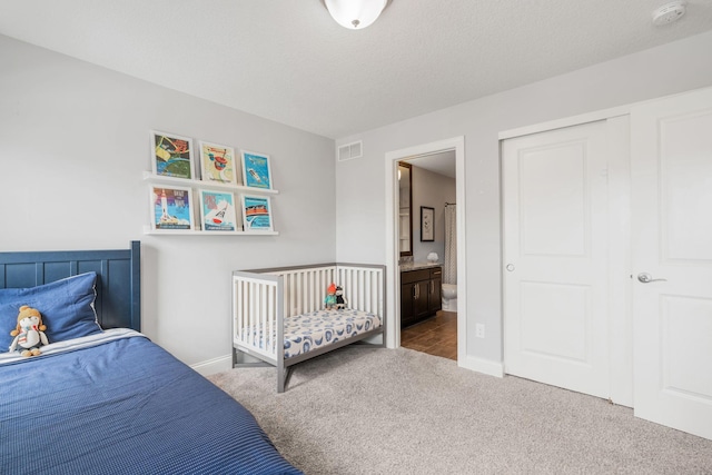 8312 Jonquil Ln N, Maple Grove, MN 55369 - carpeted bedroom with baseboards and ensuite bathroom