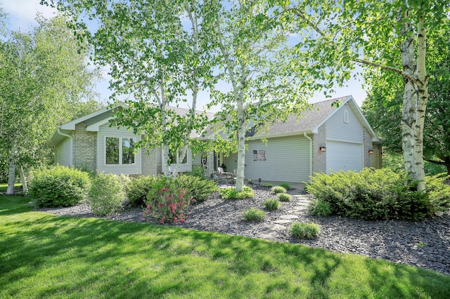 2301 170th Ln NW, Andover, MN 55304 - view of front of home with brick siding, a garage, a front lawn, and a shingled roof