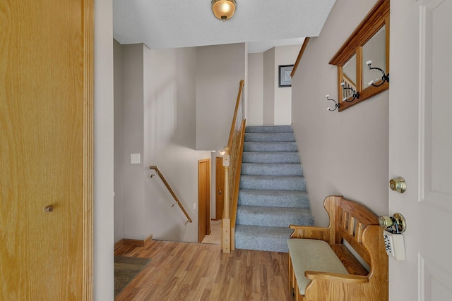 1294 Stone Ridge Rd, Sauk Rapids, MN 56379 - staircase featuring wood finished floors