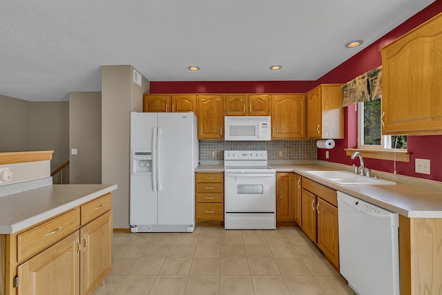 1294 Stone Ridge Rd, Sauk Rapids, MN 56379 - kitchen with white appliances, light countertops, decorative backsplash, light tile patterned floors, and recessed lighting