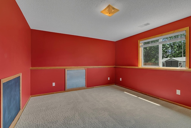 1294 Stone Ridge Rd, Sauk Rapids, MN 56379 - carpeted spare room featuring a textured ceiling and baseboards