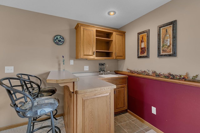 1294 Stone Ridge Rd, Sauk Rapids, MN 56379 - bar featuring a sink and tile patterned floors
