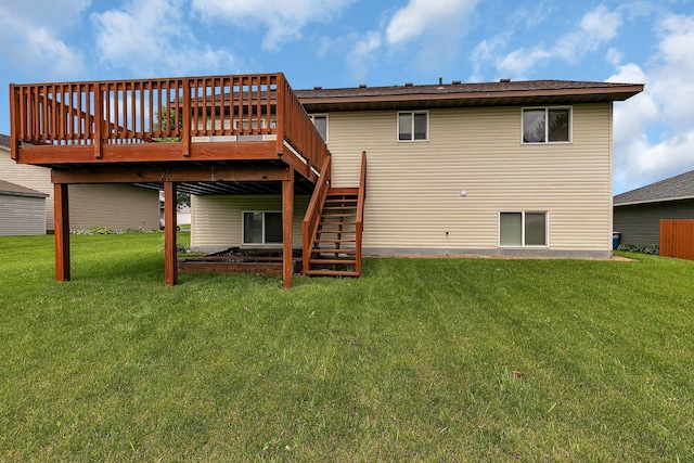 1294 Stone Ridge Rd, Sauk Rapids, MN 56379 - back of property with stairs, a deck, and a lawn