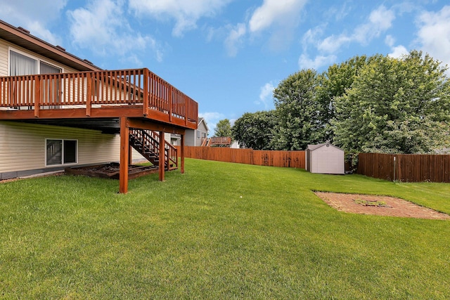 1294 Stone Ridge Rd, Sauk Rapids, MN 56379 - fenced backyard with a storage unit, a wooden deck, and stairs