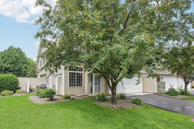 2256 River Rock Ln, Shakopee, MN 55379 - obstructed view of property featuring driveway and a garage