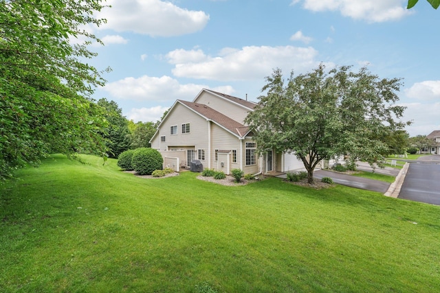 2256 River Rock Ln, Shakopee, MN 55379 - view of property exterior featuring driveway, a yard, and a garage
